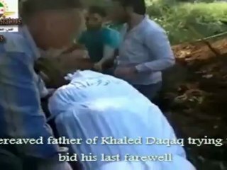 فري برس Syria  Homs Bereaved father of Khaled Daqaq at the burial of his son  Killed by Assad's  5 5 2012