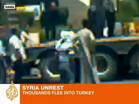 Syria protests continue as refugees stream into Turkey