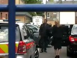 Rebekah Brooks' car gets trapped leaving police station
