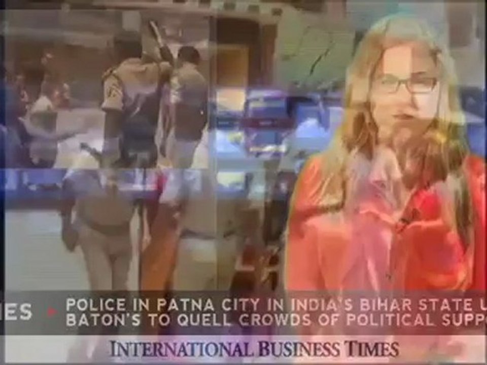 Police Use Batons Against Protesters, Including...