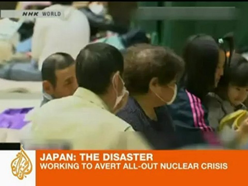 Japan dumps water on stricken reactors