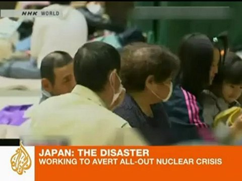 Japan dumps water on stricken reactors