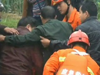 Man and his car washed into swollen river