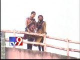 Girl climbs water tank demanding marriage to boyfriend