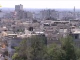 Syria فري برس  حمص قصف صاروخي على حي الخالدية وتصاعد الدخان من المنازل 30 5 2012 Homs