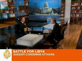 Gaddafi condemns attack on his forces