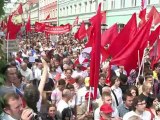 Tens of thousands defy raids to march against Putin