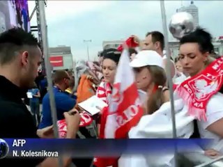 Polish fans welcome their team at the fanzone in Warsaw
