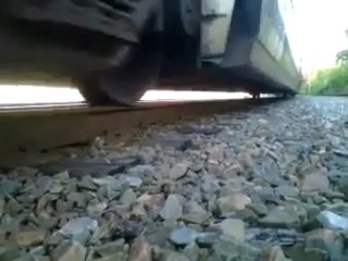 Man trapped under moving Train