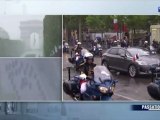 Hollande trempé après sa remontée des Champs Elysées