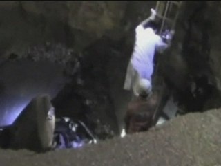 One man killed as road swallows car in China