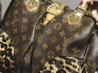 LOUIS VUITTON tattooed on pigs