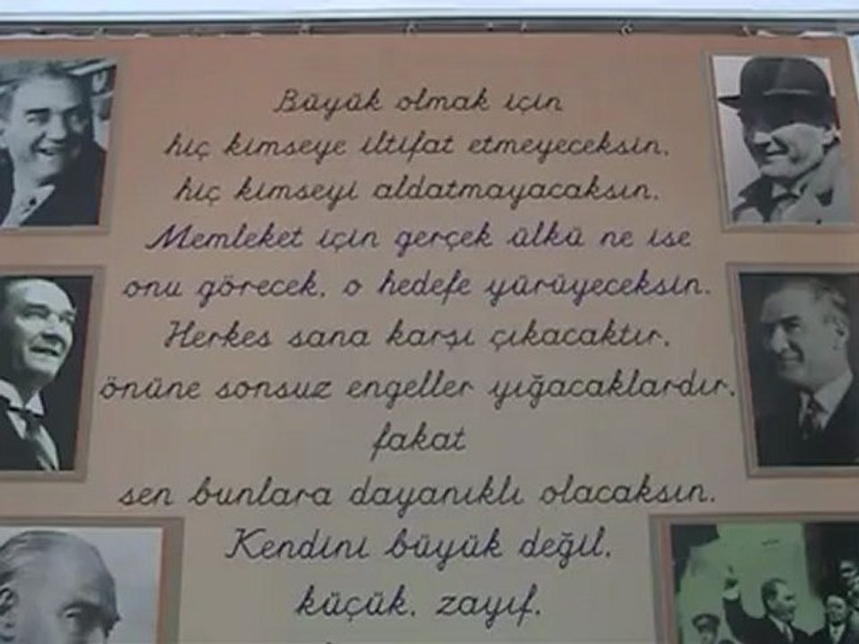 Atatürk'ün "Büyüksün" vecizesi "Hand center" yazı karakteri ve gülen fotoğrafları ile