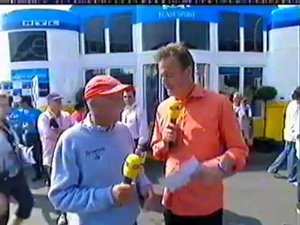 Kimi räikkönen and his dog ajax in the paddock