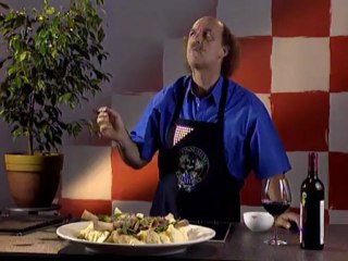 Chicken is roasted with lemons and served on a bed of pistachio pilaf.