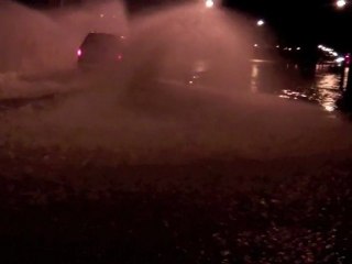 Cars Splashing through the flood Las Vegas NV