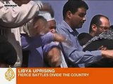 Libya rebels battle Gaddafi loyalists