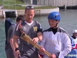 Teen Attempts to Grab Olympic Torch