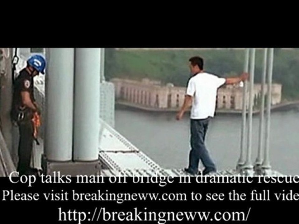 Cop talks man off bridge in dramatic rescue