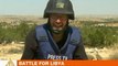 Libyan forces and rebels fight over mountain town