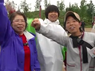 Grim weather fails to dampen Olympic spirit