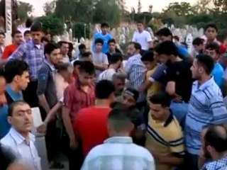 A father buries a son in Aleppo