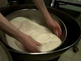 Fold The Dough .. Mr. Herman punches the dough to revitalize the yeast. Royal Oak, Michigan bakery. Small business.