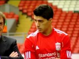 Suarez signs new Liverpool deal