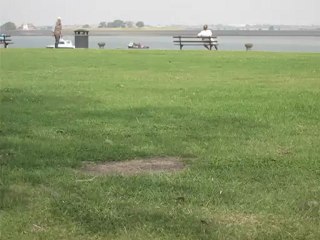 Gravesend, Sun Aug 12th 2012 - Sikh man walking backwards