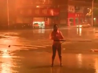 Chinese Reporter Secured To A Rope