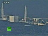 Video of helicopters water-bombing nuclear reactor, close-up shots of Fukushima