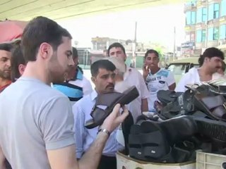 In Aleppo, traders eke out living as fighting rages