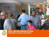Libyan fighters close in on Gaddafi hometown
