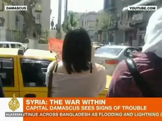 Syrian woman in defiant protest in Damascus