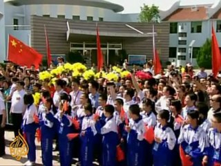 China sends first woman into space