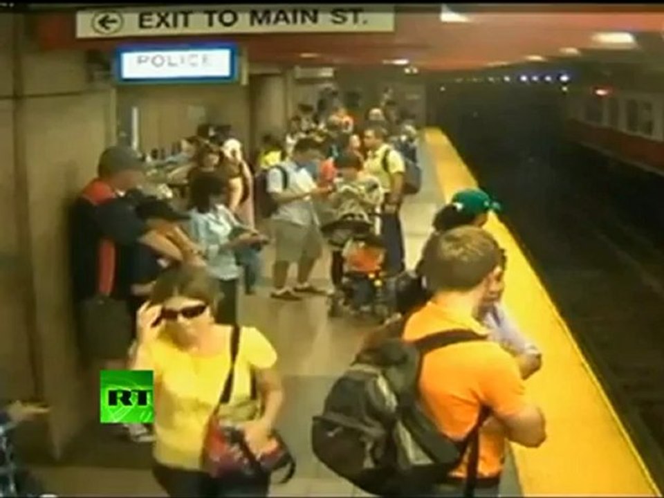 CCTV: Woman & child fall on train tracks in US subway