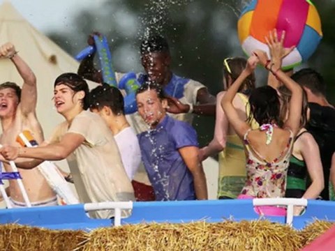 A Soaking Wet Harry Styles Flashes a New Tattoo While Shooting Music Video