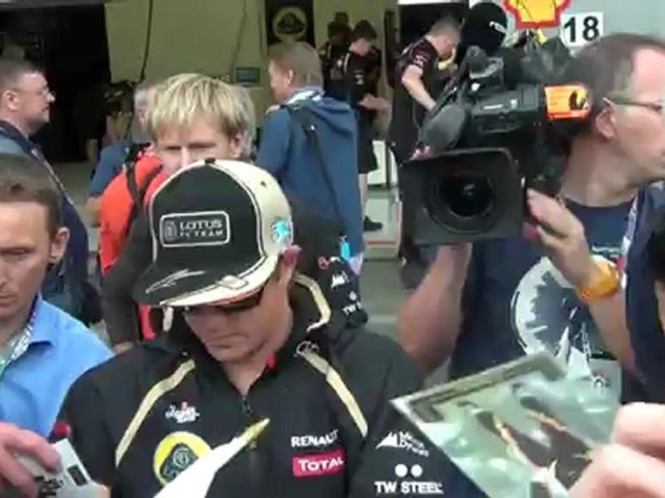 Spa 2012 Kimi Räikkönen giving autographs