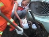 Young Chinese girl rescued after being trapped under bus