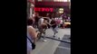 Baston à coup de baton en plein Times Square - Times Square Crutch fight2