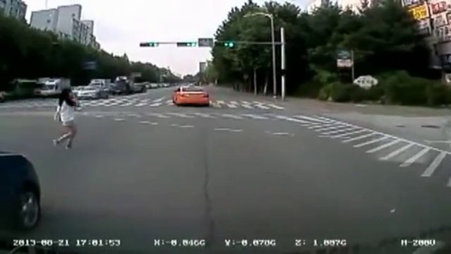 Lucky woman trying to cross the road with traffic! Be carrefull! The Truck!