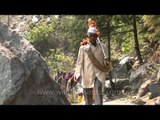 Pilgrims carrying Idol of mother Ganga passing through narrow trek