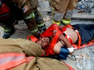Rescuers pull man from collapsed building