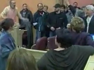 Golden Dawn's Nikos Michaloliakos gives the nazi salute at Athens Municipal Council