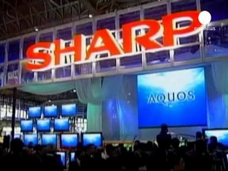 Sharp's credit downgraded as loss worries mount