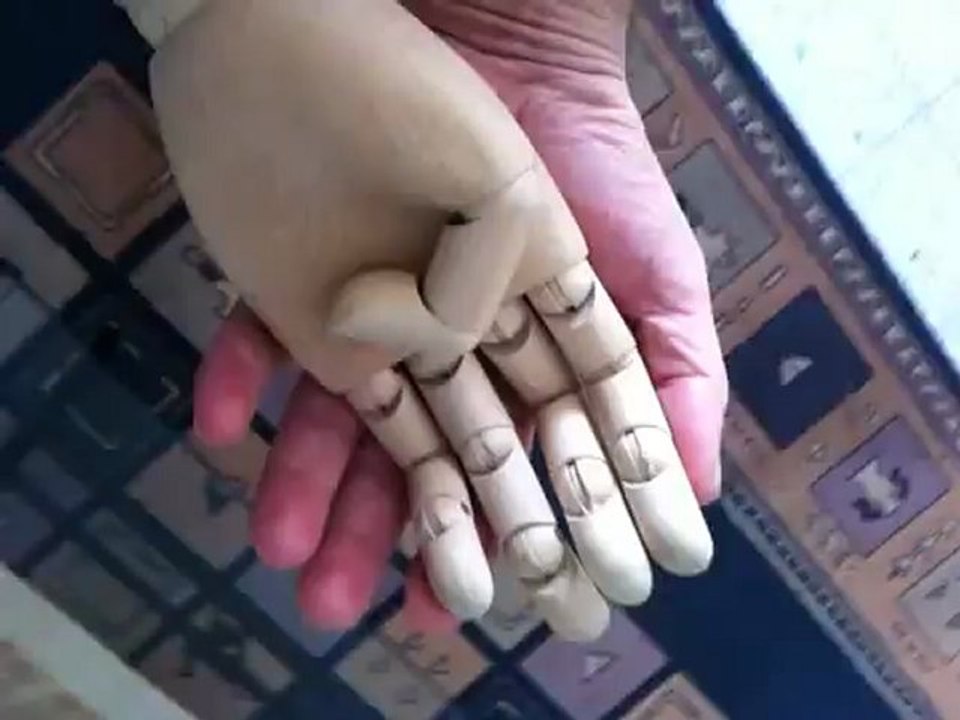 His hand was soft and warm