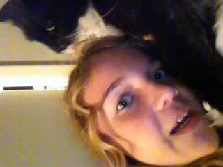 My cat Skully trying to eat my head!