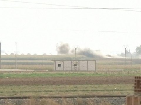 Captured Syrian border town is bombarded