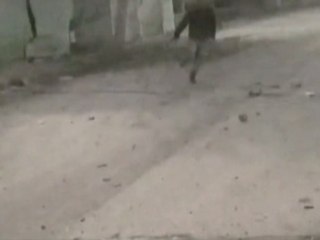 Syrian man swoops up child as warplanes close in