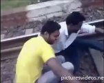 Crazy Train Stunt - Man Lies Down Under Moving Train